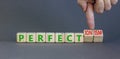 Perfectionism symbol. Concept words Perfect or Perfectionism beautiful wooden blocks. Beautiful grey table grey background.