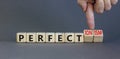 Perfectionism symbol. Concept words Perfect or Perfectionism beautiful wooden blocks. Beautiful grey table grey background.