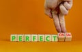 Perfectionism symbol. Concept words Perfect or Perfectionism beautiful wooden blocks. Beautiful orange background. Businessman