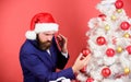 Perfectionist concept. Bearded Santa. Corporate party. Winter holidays. Perfect decorations. Man wear Santa Claus hat Royalty Free Stock Photo