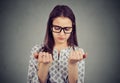 Perfectionist woman looking at fingers nails obsessing about cleanliness Royalty Free Stock Photo