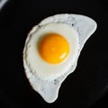 A perfectly cooked sunny-side-up egg is centered in the image. The egg features a Royalty Free Stock Photo