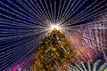 Perfectly Decorated With Garland And Toys Christmas Tree At Night Time At New Year European Fair. Bokeh