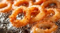 Perfectly fried onion rings crispy and golden in bubbling oil for ultimate crunchiness