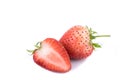 Perfectly retouched fresh strawberry fruit with sliced half isolated on white background. Royalty Free Stock Photo