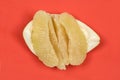 Perfectly retouched pomelo on red background