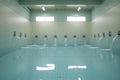 perfectly spaced pool inflow jets on the walls of an empty pool