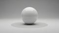 A perfectly spherical object with a reflective surface is centered on a gray background Royalty Free Stock Photo