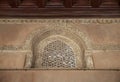 Perforated arched stucco window decorated with geometrical patterns and calligraphy at Ibn Tulun mosque, Cairo, Egypt