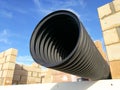 Black corrugated pipe for water canalization Royalty Free Stock Photo