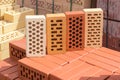 Perforated bricks of different colors and shapes of holes