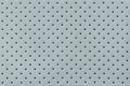 Perforated light blue leather texture background, closeup. backdrop from wrinkle skin