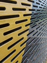 Perforated Metal Surface with Yellow and Black Contrast Royalty Free Stock Photo