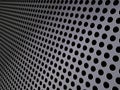 Perforated metallic grid, industrial background