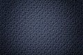 Perforated navy blue leather texture background, closeup. Denim backdrop from wrinkle skin Royalty Free Stock Photo