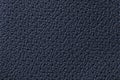 Perforated navy blue leather texture background, closeup. Denim backdrop from wrinkle skin Royalty Free Stock Photo