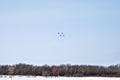 Performance of aerobatic team Russian Knights at the air show..Omsk, Russia - 19 March, 2016: Performance of Russian Knights at