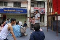 A performance group playing teacher and students at school