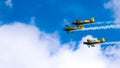 3 performance jets, flying in tandem, on a blue sky with white clouds Royalty Free Stock Photo