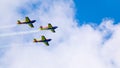 3 performance jets, flying in tandem, on a blue sky with white clouds Royalty Free Stock Photo