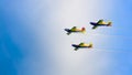 3 performance jets, flying in tandem, on a blue sky with white clouds Royalty Free Stock Photo