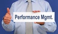 Performance Management - Businessman with sign