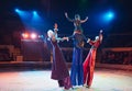 The performance of stilt-walkers in the circus