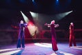 The performance of stilt-walkers in the circus