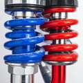 Performance Suspension - Red vs. Blue Coilovers Royalty Free Stock Photo