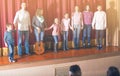 Performers bowing to audience after concert