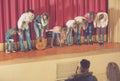 Performers bowing to audience after concert