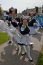 Performers dresses as waitresses serve cakes Royalty Free Stock Photo
