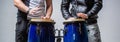 Performers playing bongo drums. Close up of musician hand playing bongos drums. Afro-Cuba, rum, drummer, fingers, hand Royalty Free Stock Photo