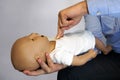 Performing cpr on a simulation mannequin baby dummy during medical training Pediatric Basic Life Support Royalty Free Stock Photo