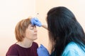 Performing eyebrow makeup in a cosmetology salon