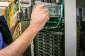 Performing work to replace the server in the data center. Installation of a new server in a rack with computer equipment. The