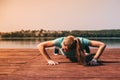 She performs exercises on pier