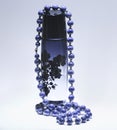 Perfume and blue pearls Royalty Free Stock Photo