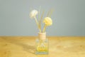 Flower perfume bottle on table background