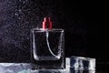 Perfume bottle and beautiful splashes of water