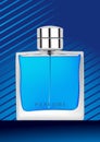 Perfume bottle in blue background Royalty Free Stock Photo