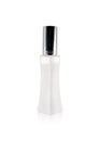 Perfume bottle in curve tube shape on isolated white background. Blank cosmetic packaging for your design.  Clipping path or Royalty Free Stock Photo