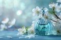 perfume bottle on flower with white blossoms and blue background