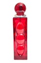 Perfume bottle in a glass of red isolated