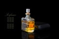 Perfume bottle isolated on black background with reflexion.