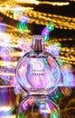 Perfume bottle and light painting. Royalty Free Stock Photo