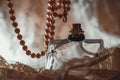 Perfume bottle with pearls Royalty Free Stock Photo