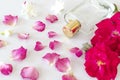 Perfume bottle with rose flower, jasmine flower and petals Royalty Free Stock Photo