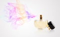 Perfume bottle spraying colored scent