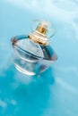Perfume bottle under blue water, fresh sea coastal scent as glamour fragrance and eau de parfum product as holiday gift, luxury Royalty Free Stock Photo